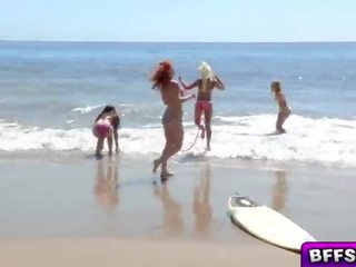 Lascivious teens flirting with the pretty life guard end up sucking his shaft